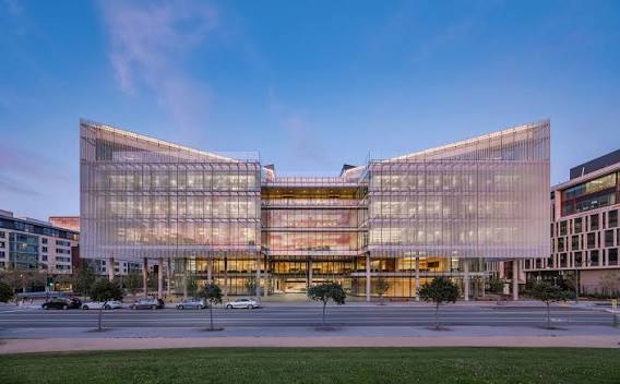 Exterior of the Weill Institute for Neurosciences building at UCSF Mission Bay at dusk